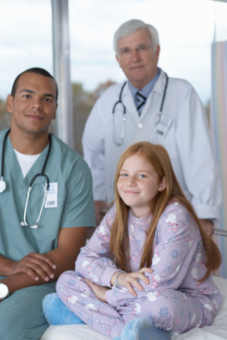image of a male nurse sitting with a patient and a doctor 