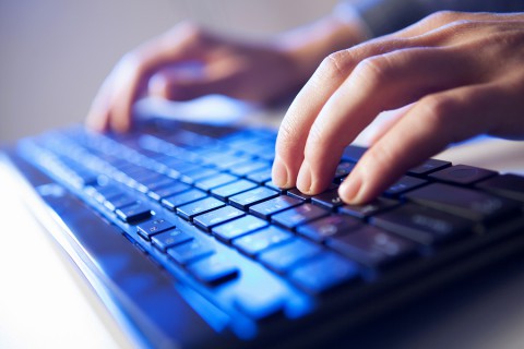 Click! Hands of a man on keyboard